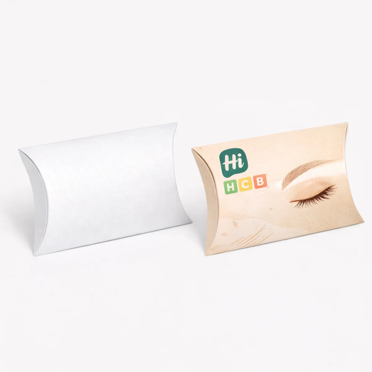 An innovative- curved pillow-style box for eyebrow pencils- crafted from sustainable kraft paper with a natural look- class=